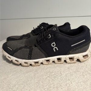 On Running Black and White Athletic Shoes with Cloud Cushioning